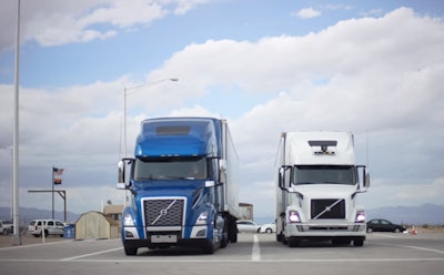 Uber Freight and the company’s self-driving-tech group have been testing freight hand-offs between an autonomous test rig (right) and shorter-haul, Uber Freight-contracted carrier at the Topock, Ariz., scale.