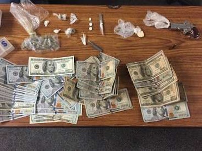 A truck driver was arrested in Indiana for possession of cocaine and marijuana, along with a firearm and more than $7,000 in cash.