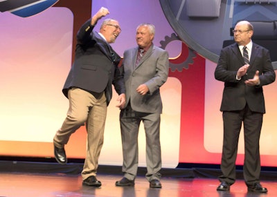Philip Keith, left, responds to the announcement that he was chosen as 2017 Owner-Operator of the Year.
