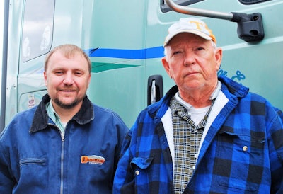 Jerry Boyd (right), with Landmark International rep Corey Price and Boyd’s 2016 ProStar, leased to Bennett Motor Express. Last month, Boyd on the verge of trading the ProStar for a new truck to close his trucking career under a five-year 500,000-mile warranty.