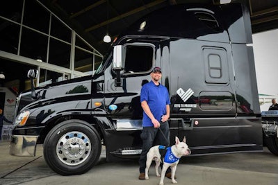 James Rogers, his purebred American Staffordshire Terrier named Sergeant, and his remodeled Freightliner. (Image Courtesy of Progressive Commercial/Allison+Partners)