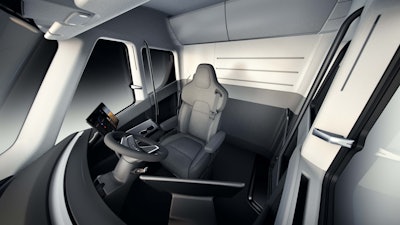 Tesla last November presented a completely reimagined truck interior for its Semi that includes a center-mounted seat, more in the style of a cockpit. On each side of the driver will be large touchscreen displays to house electronic logging applications, navigation, truck information and camera displays.