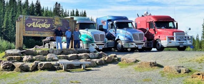 Three trucks rounded out the 2017 group as well, the owner-operators shown here together at the Alaska welcome sign on the 2017 run (that’s Boyd on the right, Lawrence in center).