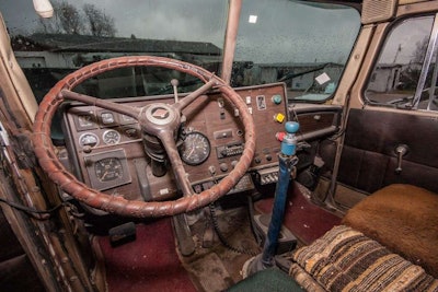 Shutters on the radiator were controlled by the thermostat (pretty neat). It also had an air clutch engine fan, a Racor inline fuel heater that has engine coolant circulating through it to keep the fuel from gelling at the fuel filter. External inline engine block heater. Jacobs engine brake. Dual stacks, dual air horns, and air-operated windshield wipers. (I always liked those.) It has power steering and the big steering wheel like a truck that doesn’t have it (I love that, too). Headache rack. Kysor air conditioner on the roof. It has a hand throttle with a center button release (a lot of drivers, me included, used those for a cruise control).