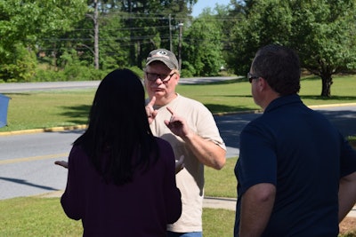 Woodle and his interpreter, Liz Spiller, communicating after he passed his CDL skills test Wednesday.