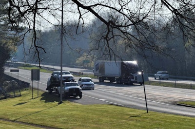 Get in where you fit in? At 9 a.m. on a fairly recent morning at the I-40 rest area serving both EB and WB traffic near one of the Caney Fork River crossings in Middle Tennessee, this hotshot car hauler was one of the several truckers parked along various parts of the get-on/get-off ramps as most primary truck spaces there remained full.
