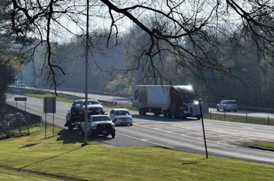 This hotshot car hauler was parked on an I-40 rest area’s ramp shoulder in middle Tennessee around 9 a.m. Other truckers also occupied ramp areas as central parking places remained nearly full. Many truckers say peak parking times have broadened since the ELD mandate went into effect.
