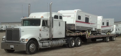 baker & sons truck hauling sportsman campers