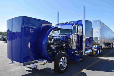 Mike Manuel’s “Autism: One of Many” 2015 Peterbilt 389 with 2016 Mac curtainside is on display at SuperRigs. The truck is a rolling awareness campaign for autism.