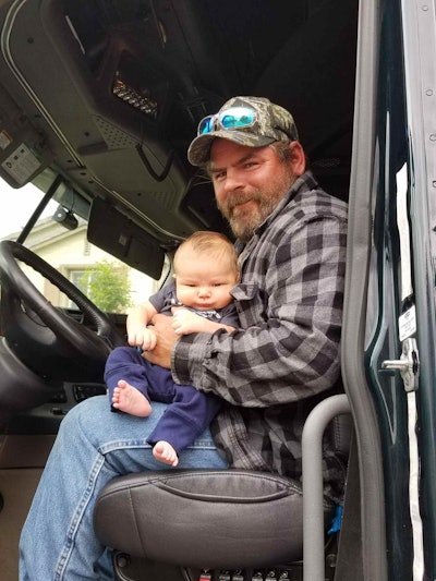 Smokey Point Distributing company driver Dereik Rich, with his grandson in the seat of the 2013 Freightliner Cascadia Rich drives, believes a move to the fleet’s salary program will more than double his former pay for doing local hauling work for the company. “Not many companies do a salary for their drivers,” Rich says. “I see this taking off, Smokey Point being a leader in setting a new precedent.”