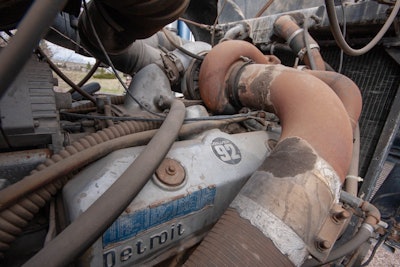 Opening the hood I was stunned to find a Silver 92 V8 Detroit (445 hp) in it. Whoa! Never saw a Super-Liner with a Jimmy in the circles that I ran in. The alternator and air compressor drive off the back of the motor. The transmission is a 13 speed.