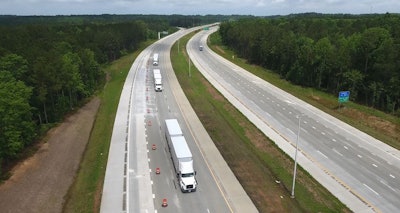 Three Volvo VNL trucks and trailers platooning along North Carolina’s Highway 540.