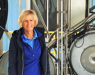 Broker Pam Young, pictured with machinery at her new-ish Healthy Trailer, LLC, reefer washout location in King City, Calif. Working with some others, she helped patent this partially automated washout machinery anticipating a “better way” being ultimately necessary as a consequence of the Food Safety Modernization Act’s requirements of shippers, carriers and brokers. Read more about FSMA repercussions to date at this link.