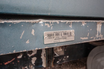 The interior of the cab and sleeper was all carpeted and button tucked. There is a custom Sawaya sleeper on back; you can see it would have been very nice before the fire. This would have been a comfortable truck to drive.