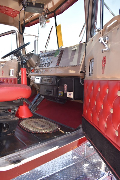 The interior of the classic KW is still mostly original except for a couple of gauges on the dash. The wood floors are original with the truck, and the diamond-tuck button upholstery was redone when the truck was restored.