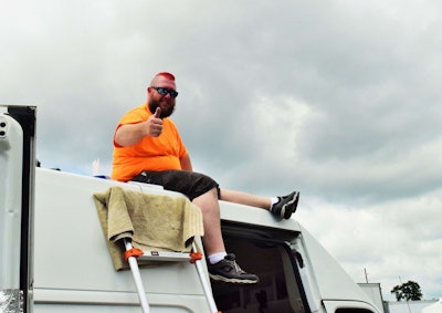 Eric “Red” Redden hard at work at Expedite Expo on a roof fan install. His Red’s Custom Design business is based in Taswell, Ind.
