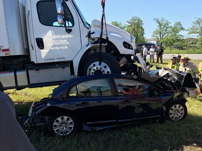 The New York State Police released this photo of the crash scene, which left the driver of the passenger car dead. Police say driver Kristofer Gregorek was taking an online survey on his phone when his truck rear-ended the passenger car.