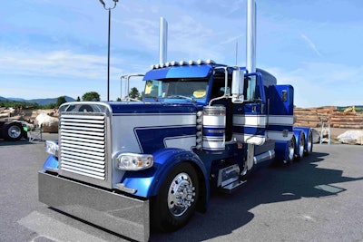 Some custom features of the truck include Peterbilt 389-style headlights, chopped breathers, a shaved hood crown and more.