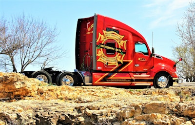 Former Seneca, Mo., firefighter Randy Rogers drives team with his wife Elizabeth in this Kenworth T680 for Certified Express, Inc. (CEI). The rig, christened Memorial Run, was designed with a central mission in mind — to honor the memory of fallen firefighters everywhere.