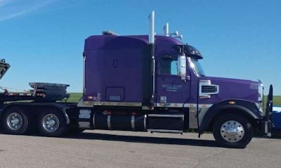 2014 Freightliner 122SD hauling Canadian military equipment
