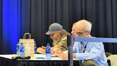 The judges at work, from left: “Mountain Man” Tim Guraedy from the “Duck Dynasty” show, Tim Walker of Westwood One, and Overdrive‘s own Max Heine.