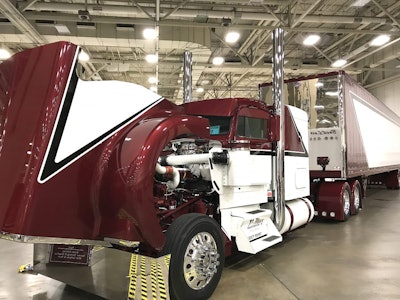 V-Max Transportation, based in Zeeland, Michigan, is showing this 1995 Kenworth W900L and 2016 Utility dry van. It features a Cat C15 with an 18-speed and sits on a 280-inch wheelbase.