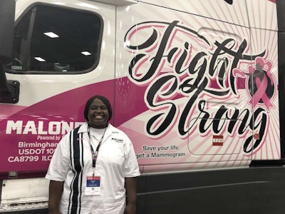 CRST Malone surprised owner-operator Chanita Ward with a custom breast cancer truck wrap during a ceremony at the Great American Trucking Show.