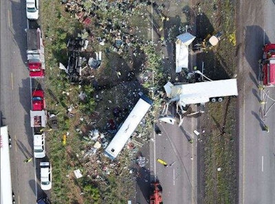 A tractor-trailer reportedly blew a steer tire along I-40 in New Mexico, causing it to cross the median and strike a Greyhound bus head-on, killing eight. (New Mexico State Police photo)