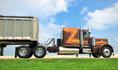 It’s a tough truck, Prifti notes — when he hauled dump trailers with it, one fateful morning he found himself unloading peat moss on just the slightest of inclines. Given how slow that particular commodity is to make it’s way out of the trailer, and a variety of other factors, the worst happened that particular Tuesday early morning, the sun just on the horizon and hampering visibility in his mirrors. “I rolled it over” on its side, he says. When a crew got it back upright, “I dumped the rest of the load out,” fixed a broken tank strap, bracket and sleeper boot, and “was back hauling by Thursday.” Later inspection showed the frame out of alignment by about an inch, which also got fixed. “Otherwise, there was barely a scratch. I had to do zero body work. The truck is tough as nails.”