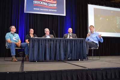 Panelists, from left: Gary Buchs, owner-operator leased to Landstar; Desiree Wood, independent owner-operator and president of Real Women in Trucking; Allan Rutter, Freight Practice Leader at Texas A&M’s Transportation Institute; and Mike Johnson, a transportation planner at the North Central Texas Council of Governments. Scott Grenerth, far right, moderated the discussion. Grenerth is a consultant for Truck Specialized Parking Services and a former owner-operator.