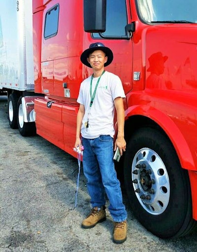 Isaac Ho, pictured with his Volvo, decided to forgo a factoring arrangement, instead relying on technology-enabled brokerages’ platforms for quick payment to his new independent business.