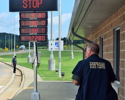 Tennessee Highway Patrol Sergeant David Mills works the Giles County inspection station, opened in recent years on I-65 NB just across the Alabama line with large inspection bays, sophisticated weigh-in-motion and scanning equipment and a special around-scale bypass lane.