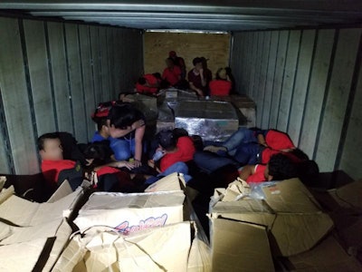 Laredo Border Patrol agents found 55 illegal aliens in sweltering conditions in a locked tractor-trailer at the Interstate 35 Border Patrol checkpoint last week. (U.S. Customs and Border Protection photo)