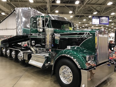 Manning originally planned for his new W900 to be red and black but decided to change it to green and black to support dwarfism awareness.