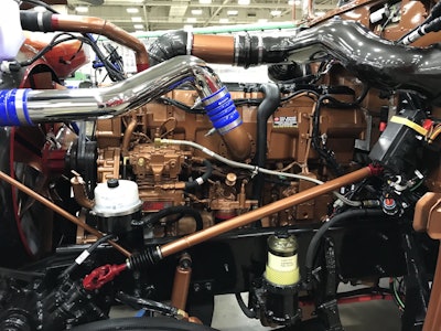 Ramirez’s rig is powered by a Cat C15 6NZ with an 18-speed and 3:55 rears. He painted the engine to match the dark saddle brown color of the truck’s exterior.