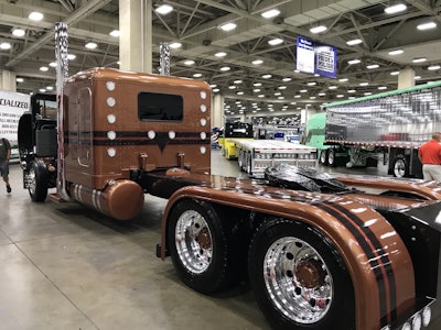 The truck was originally painted solid brown, but Ramirez wanted to make some changes, so he sent it off to add the black stripes with red accents, while also adding more pearl and metal flake to make it pop more.