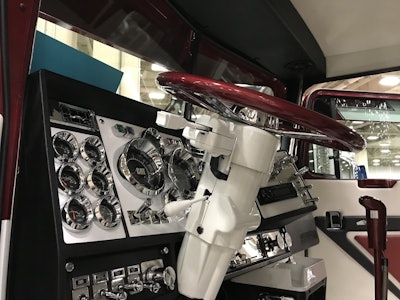 The steering wheel and dash panel of the truck are painted to match its exterior.