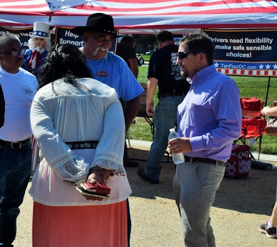 If one thing’s certain, the groups here and truckers around the nation have no doubt inspired the ears, at least, of federal regulators, if not yet much in the way of the regs-revising pens. FMCSA Director of Enforcement and Compliance Joe DeLorenzo (pictured, right) spent upward of an hour early this afternoon making connections and discussing the regs with owner-ops.