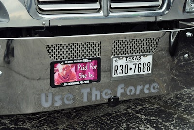 As promised two years ago, Tammy Groom followed through on installing the “Paid for, she is” license plate on the Grooms’ 2012 KW T660.