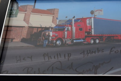 Clayton has an autographed photo of Simpson with the Nitro Express outside of the dance hall where he first saw it.