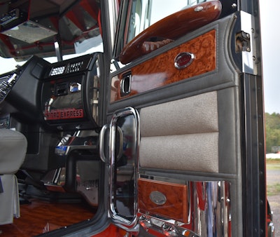 The interior door handles are Rockwood in the African rosewood variety. They have built-in finger grips. The cab floors are also the African rosewood from Rockwood.