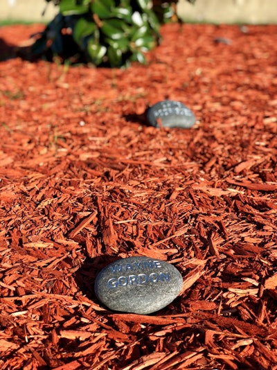 The company also worked back through its internal records to identify 25 more former drivers either leased to or employed by CalArk or affiliates they’d lost on-duty in the past, then dedicating “hero stones,” Stevens says, and placing them around the magnolia at the memorial site. At the Fearless Rock underwater memorial, similarly, members of Adam Brown’s SEAL team who, after his own passing, had subsequently perished in the Extortion 17 disaster in Afghanistan in 2011 (the largest single-event loss of life in special-ops history) all had been honored a stone as well. “One of the most important things at the [Fearless Rock] memorial,” Stevens says, has been that “sometimes the family members come out they just want to hold their husband’s or dad’s stones. When we did [the drivers’ memorial], that was a thought that I had. For one, it’s perpetual, it’s a living memorial, something you can keep building on. Also, it honors the individual, not just a group, when you can remember somebody in particular and remember a name.”