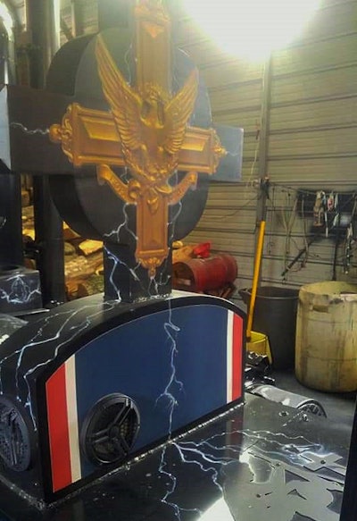 The newly fabricated remembrance cross sits ahead of the memorial added in early 2017 on BlackOut’s deck.