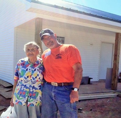 Gary Buchs, the author of this story, is here pictured with a New Bern homeowner after completing a job.