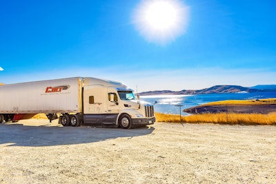Take this photograph of Watson’s truck and trailer, for example. The final image is made up of “two different shots,” he says, one of which “has been duplicated.” Ultimately, there’s three digital layers to the final image. One is exposed with, effectively, a light reading on the truck, “so the sun isn’t overpowering” the ability of the camera to capture detail of the truck, otherwise in shadow. (Watson says he simply put his thumb over the sun for that portion of the picture.) “Then I dropped the camera sensitivity down to get the sun in the whole thing,” merging the images together with editing software. Interestingly, Watson adds, “there were no clouds the day I shot,” just straight blue sky far as the eye could see. Haze near the horizon, an effect of the brightness of the sun, however, created the appearance of distant cloud-cover in the photograph.