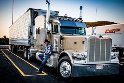 This shot is of an owner-op Watson struck up a conversation with at a produce house out west. “I saw him standing there with a cigarette, and I thought, if I get the camera it’s going to be magic.” Before doing so, he asked if he could take the photo, “took about six shots and then stood there talking to him. He was wanting to hurry up and get his oranges on so he could get down the road” to talk to man quite actually “about buying some race horses.”