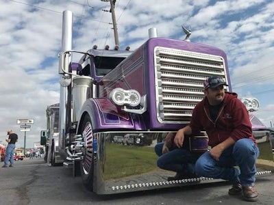 “This picture of Tony Justice kneeling down” in front of Josh Foster’s Trux Accessories “Purple Haze” custom build at GBATS this year, Sarah notes, “was actually staged specifically by Robbie” with the trucker/singer-songwriter.