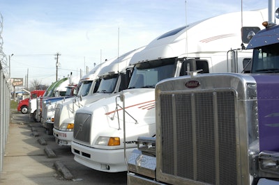 row of parked semi trucks