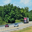 Truck-amid-cars-on-highway-soft-focus-2018-12-03-13-12