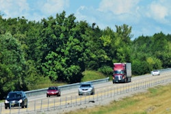 Truck-amid-cars-on-highway-soft-focus-2018-12-03-13-12